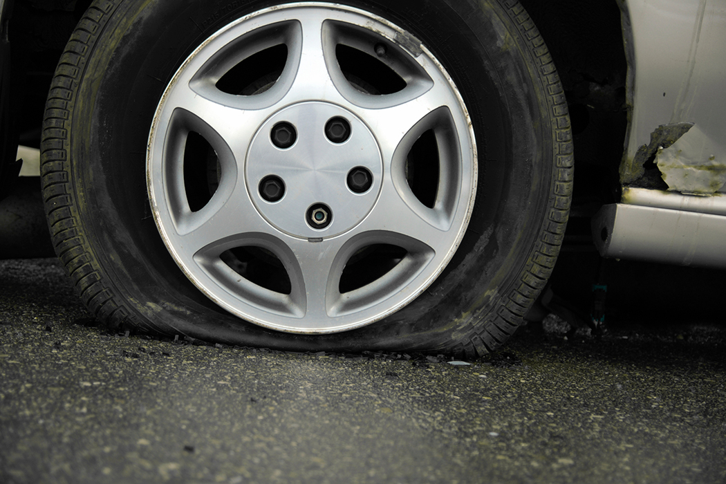 Flat-Tire Flat tire and possible rim damage from hitting a pothole